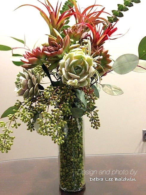 Succulent bouquet with eucalyptus and dried split peas