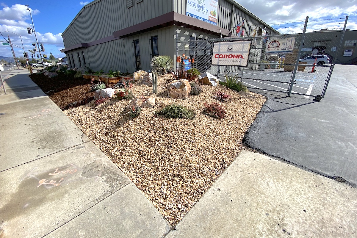 Gravel is a smart solution for an area where cars could run over landscape plants. (c) Debra Lee Baldwin