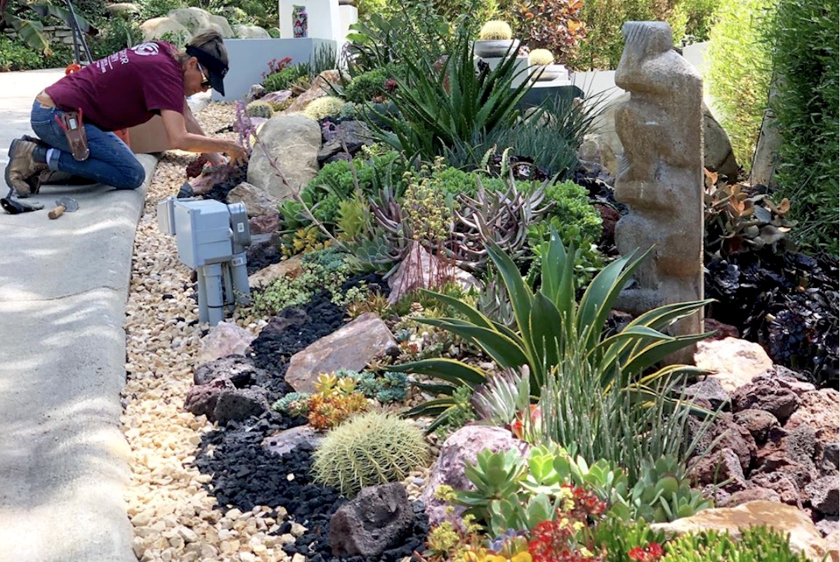 Laura Eubanks maintaining a garden