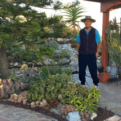 George Tabora in his succulent garden